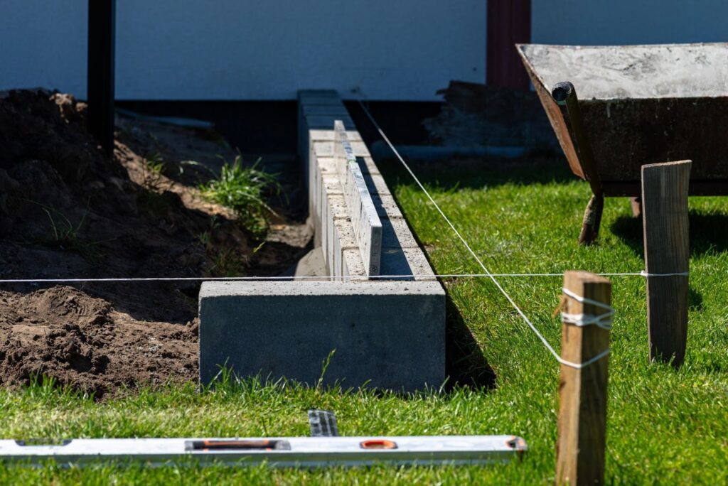 A retaining wall being built on a construction site.