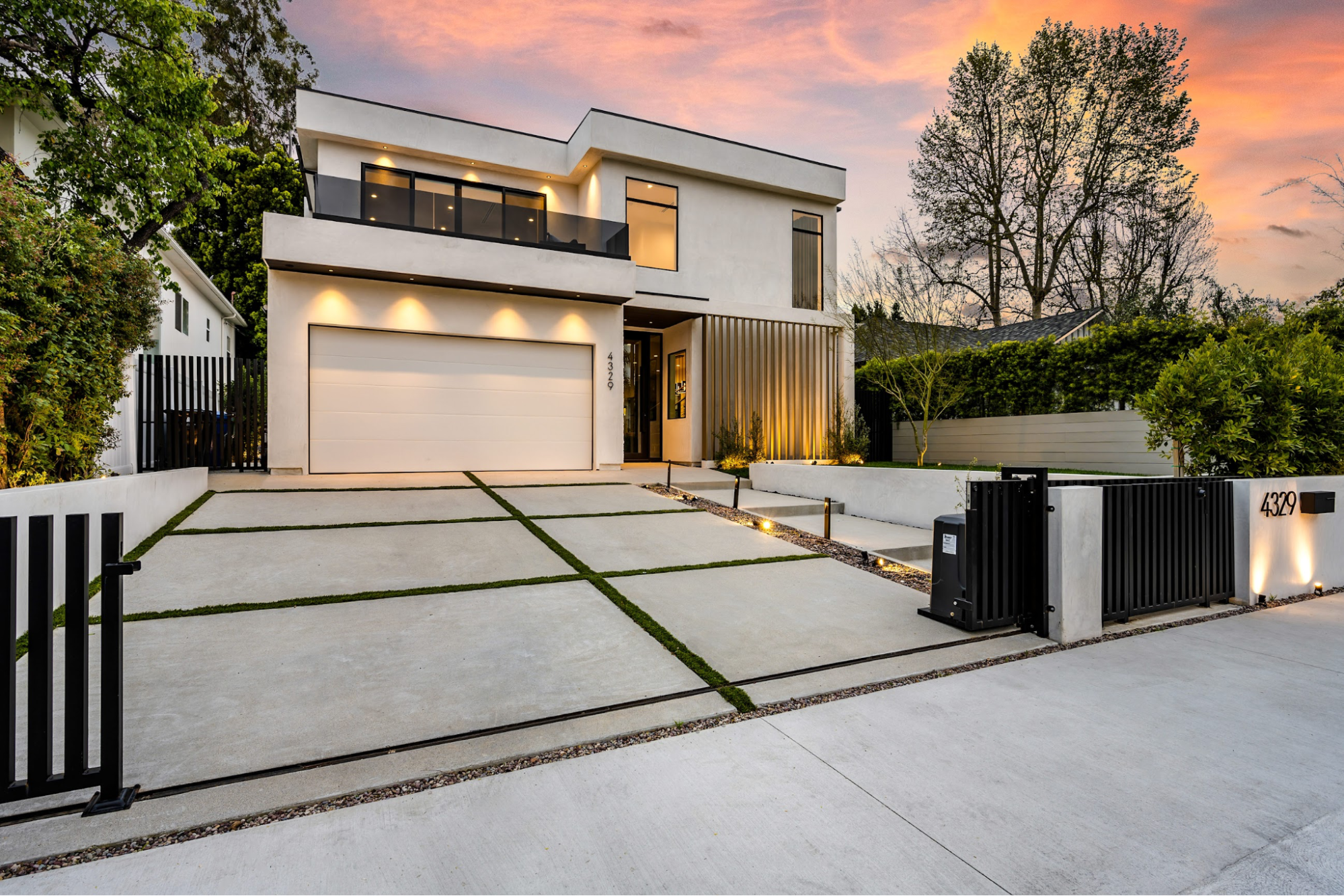 A house with a concrete driveway.
