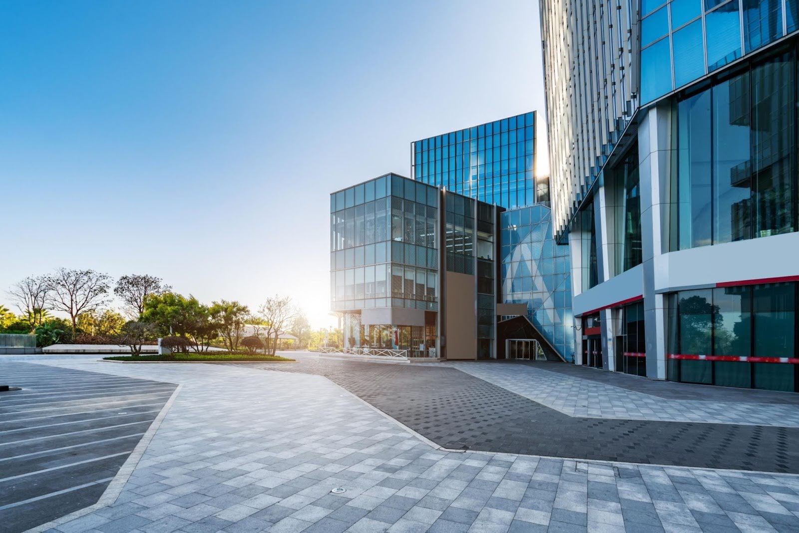 Modern office buildings with a clean, professionally paved driveway enhancing curb appeal.